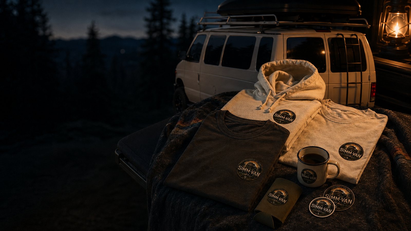 SimmVan gear staged on a wool blanket on the van tailgate at dusk
